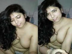 Beautiful Desi with huge boobs and a cute face is smiling for the camera XXX