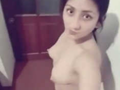 Beautiful Desi girl with natural boobs taking XXX selfies and touches her tits