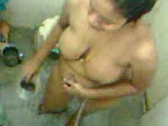 Desi aunty is having XXX bath in the shower while a voyeur is recording that
